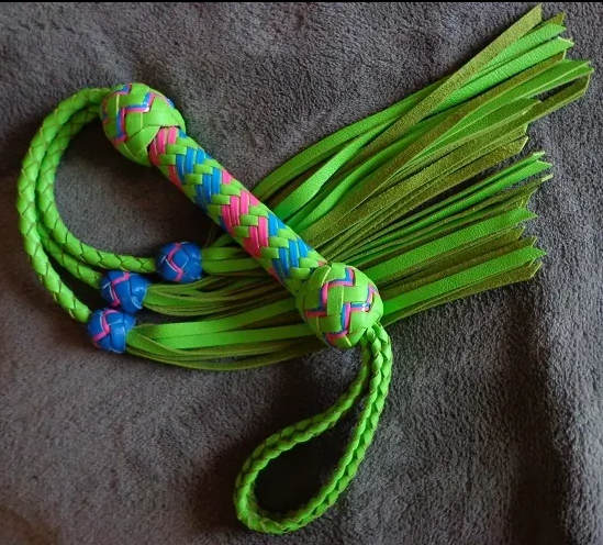 (Above) Single colorful braided paracord flogger with fringe. (#set006)
